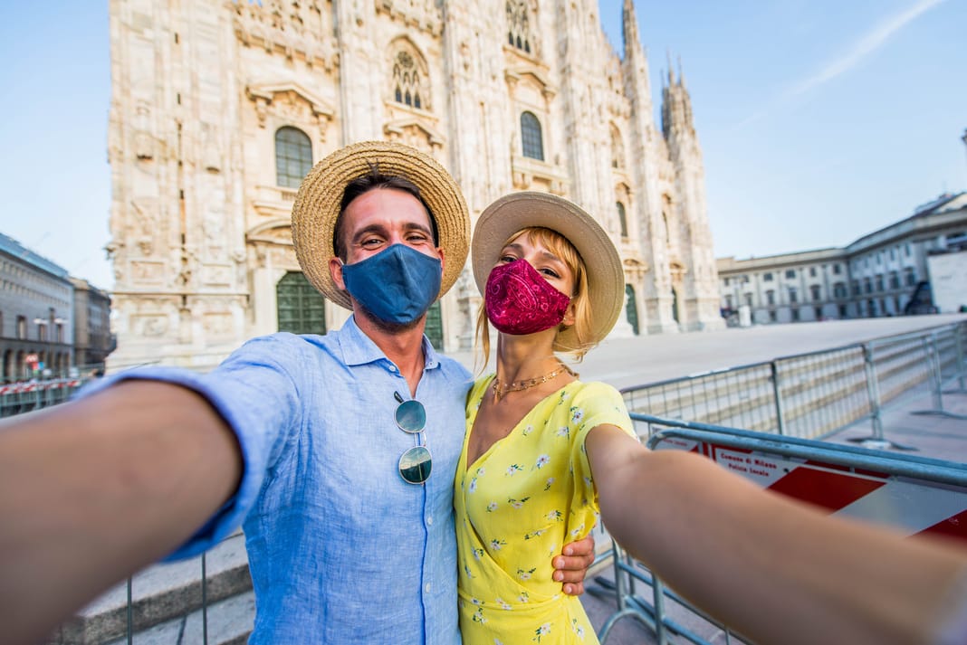 Tourists wearing face masks during the new covid outbreak selfie.