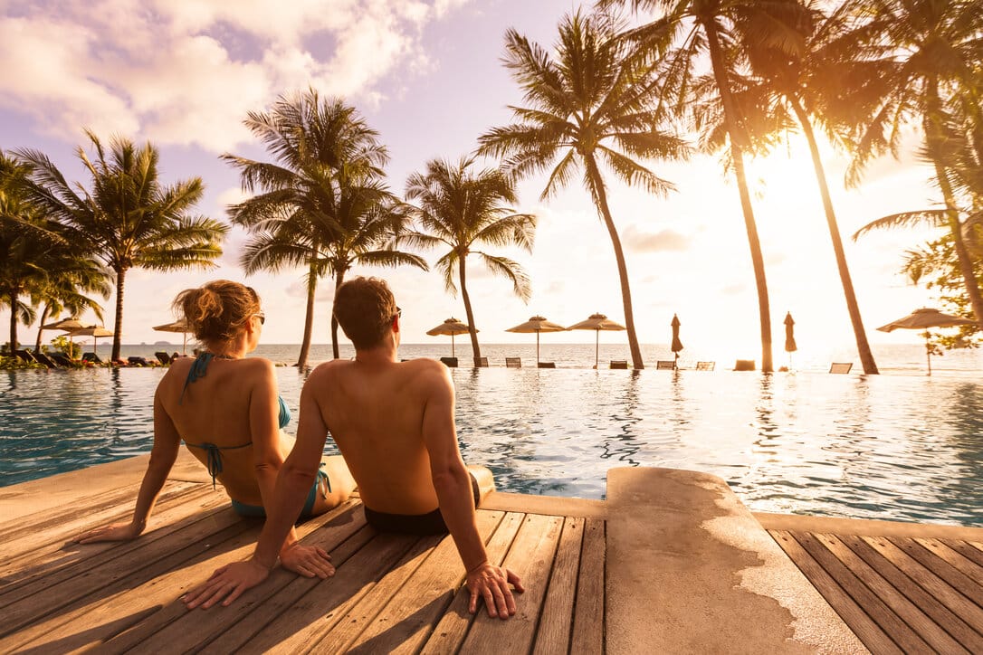 Two people enjoying their vacations at a Caribbean island.