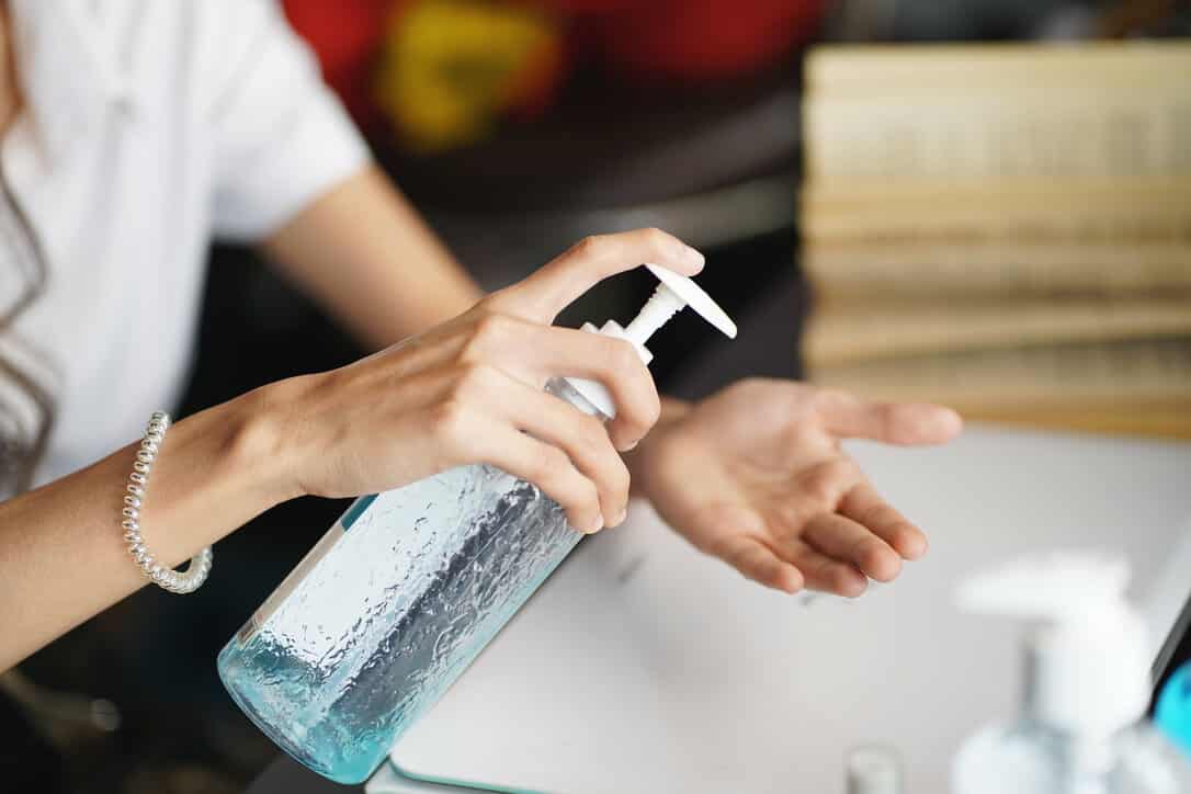 Woman using hand sanitizer, which is still one of the best ways to prevent Covid-19 and also Monkeyplox.