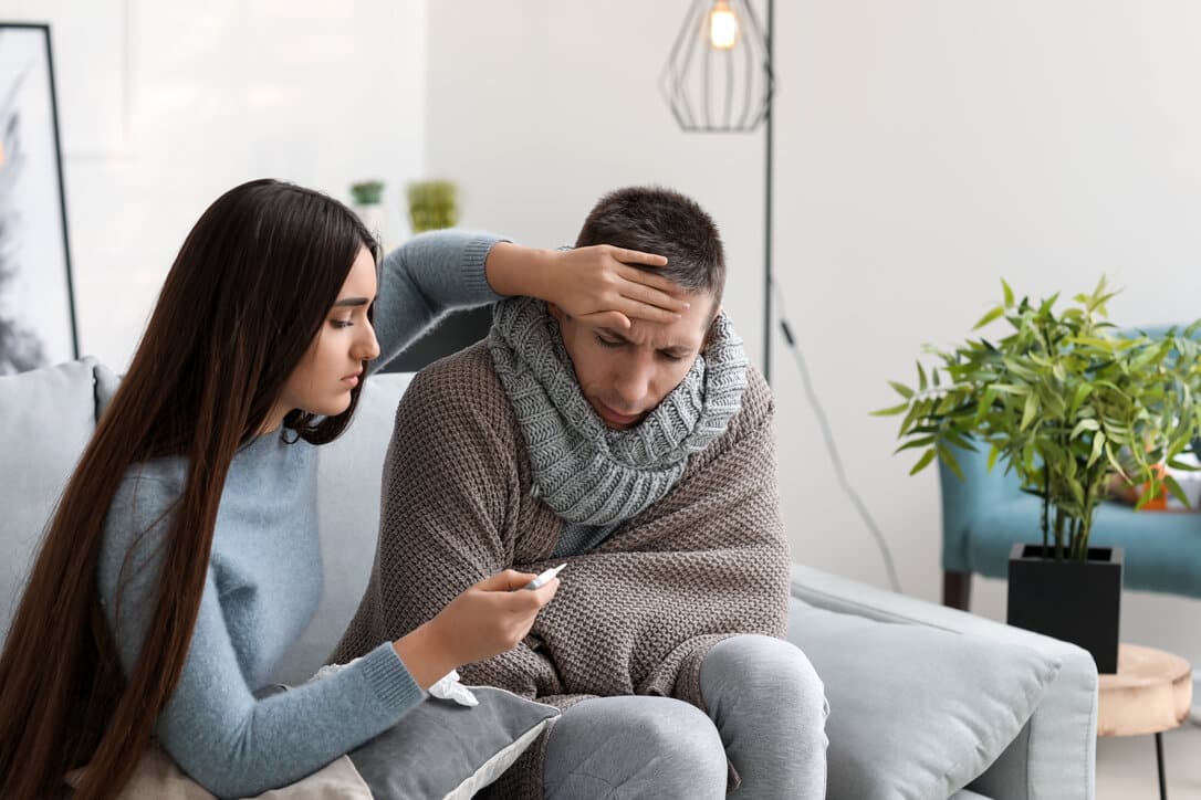 Young woman taking care of a male friend who's experiencing Monkeyplox syntoms