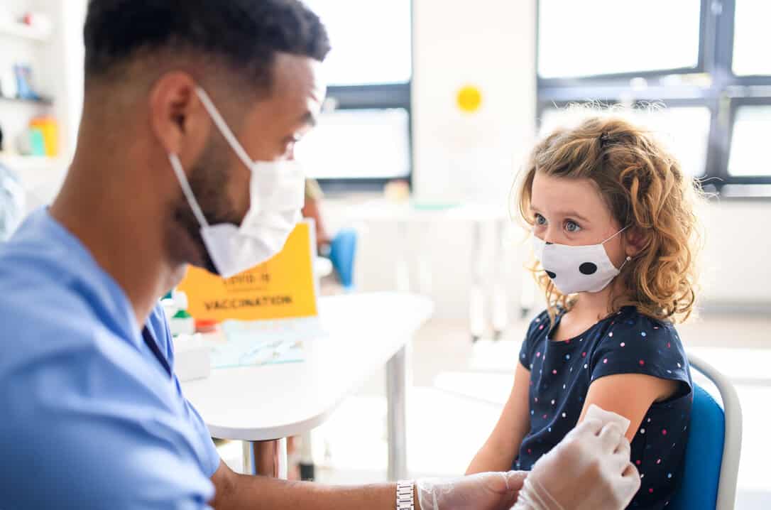 Girl getting a vaccine against Covid