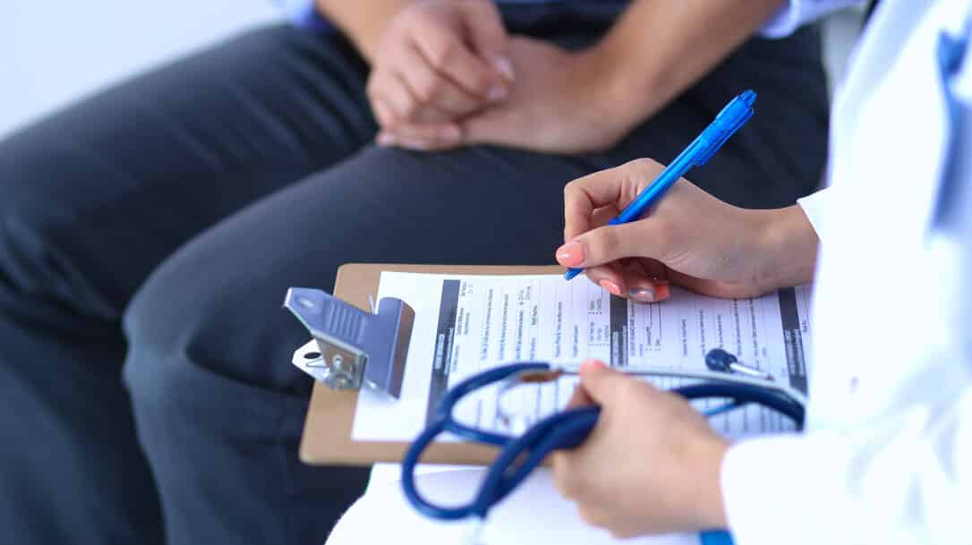 Nurse registering a patient with symptoms of Covid, BA.2.75 variant