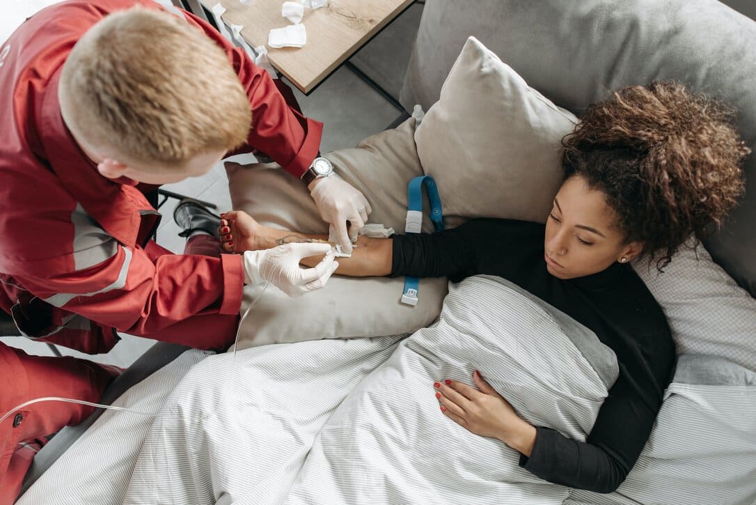 Young woman getting urgent medical assistance.