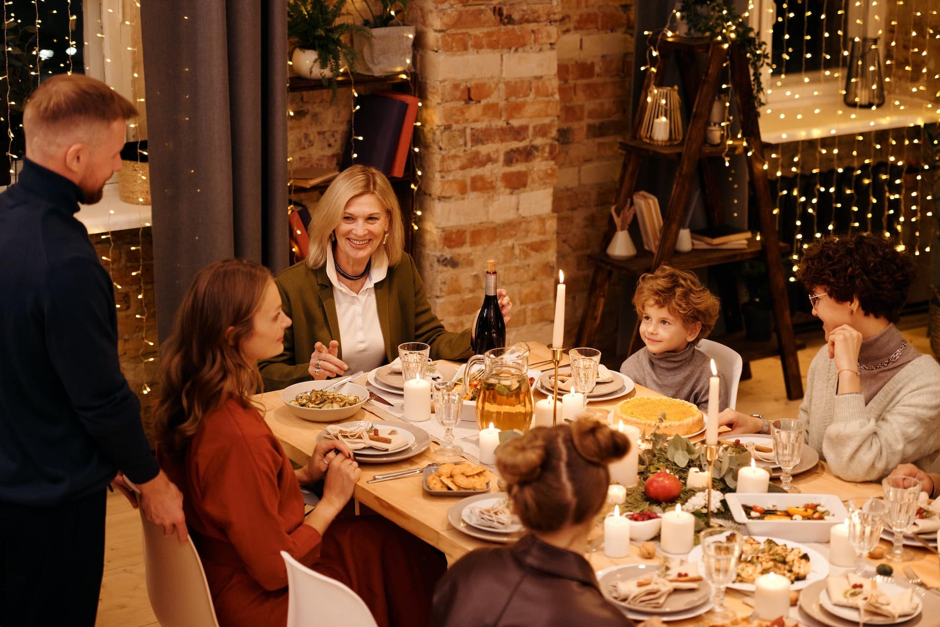 Family celebrating Christmas dinner during the Holiday Season.