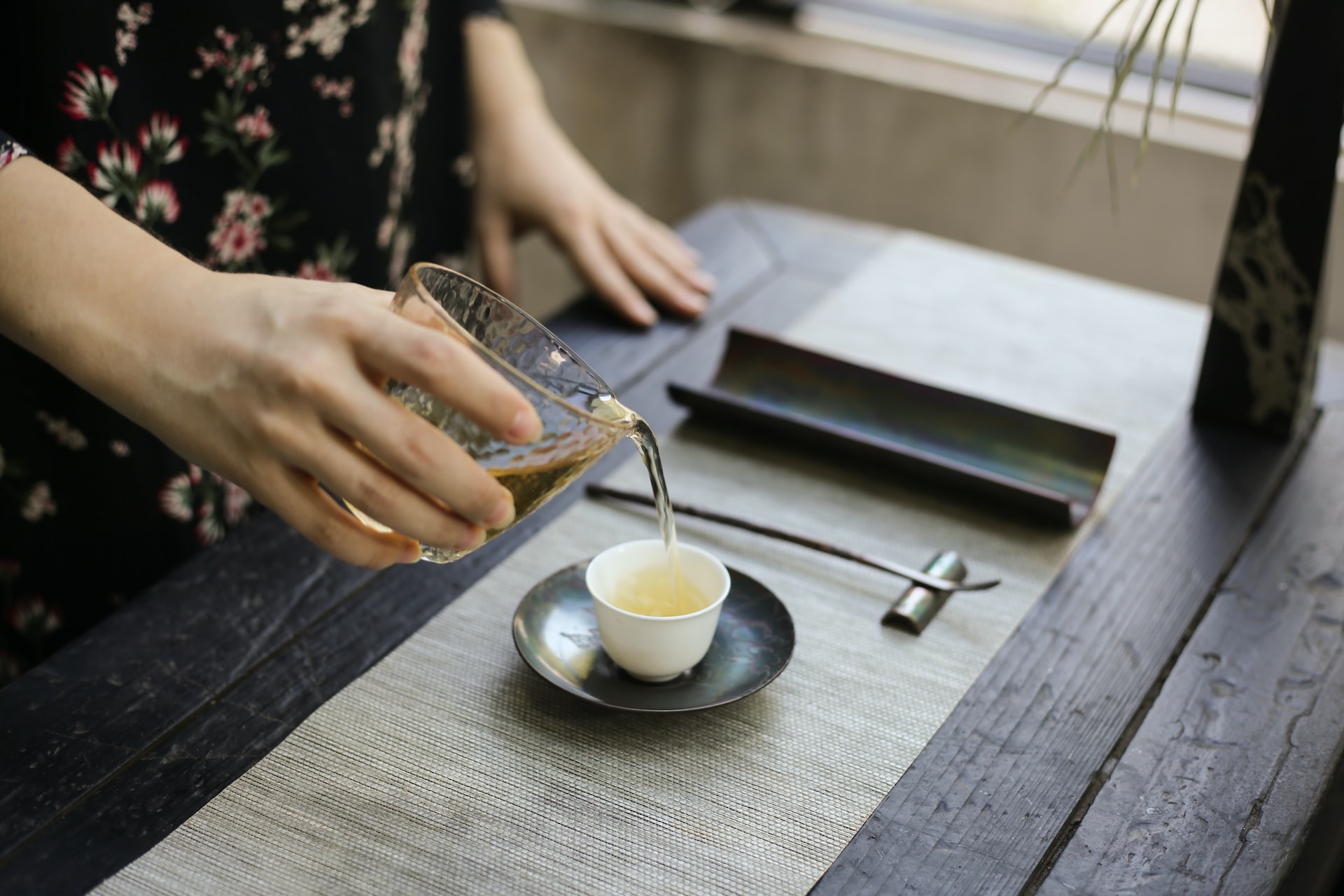 Chinese woman serving tea.